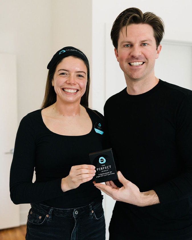 a man and a woman posing for the camera